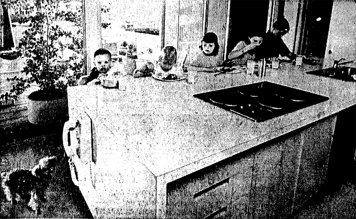 Five of the Beadle children eat at the kitchen counter